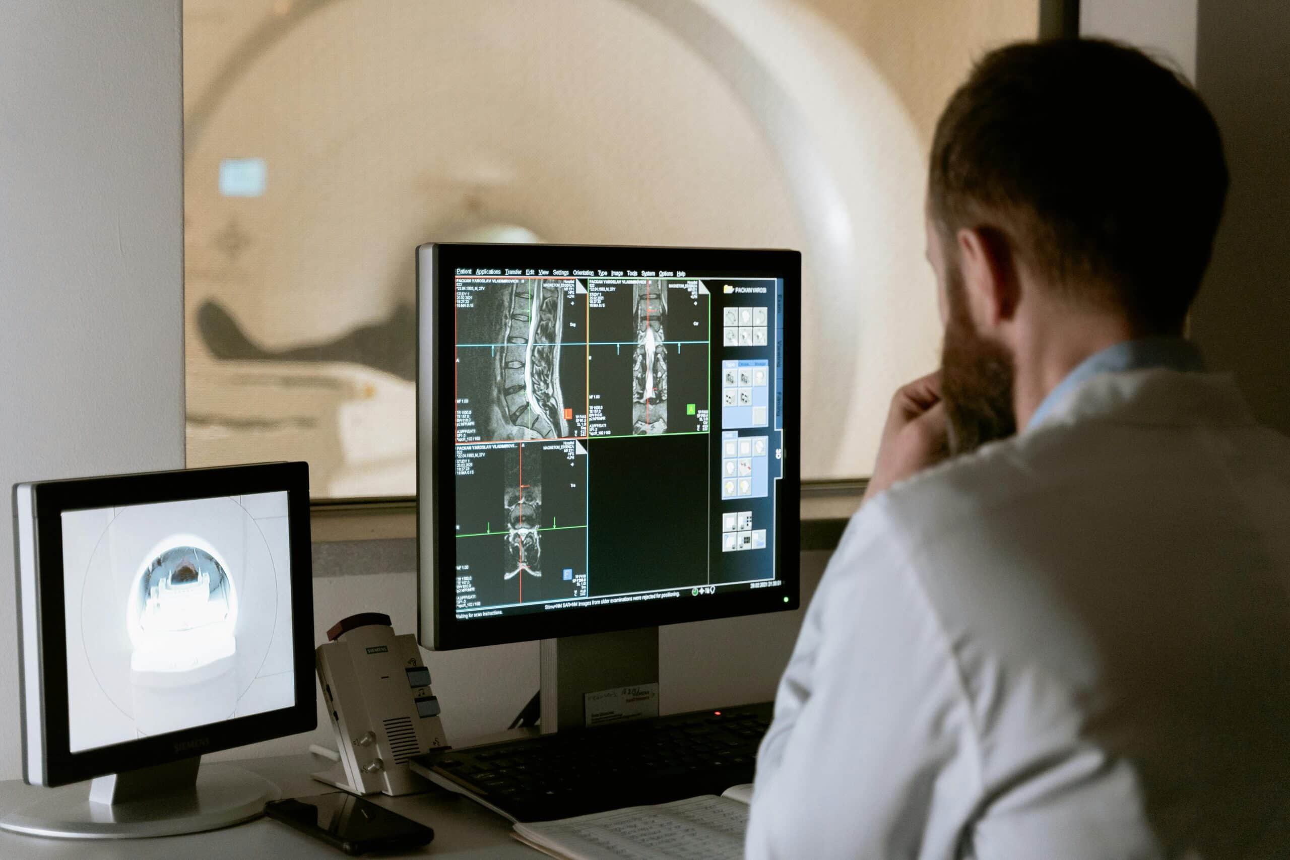 Photo of Doctor Looking at Healthcare Imaging Technology Scan