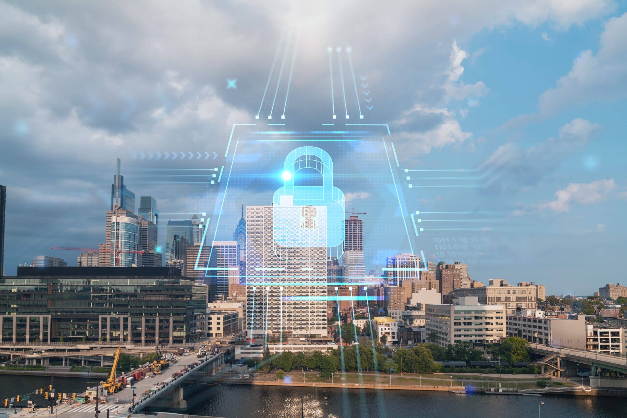 Aerial panorama city view of Philadelphia financial downtown at day time, Pennsylvania, USA. Glowing Padlock hologram. The concept of cyber security to protect companies confidential information.